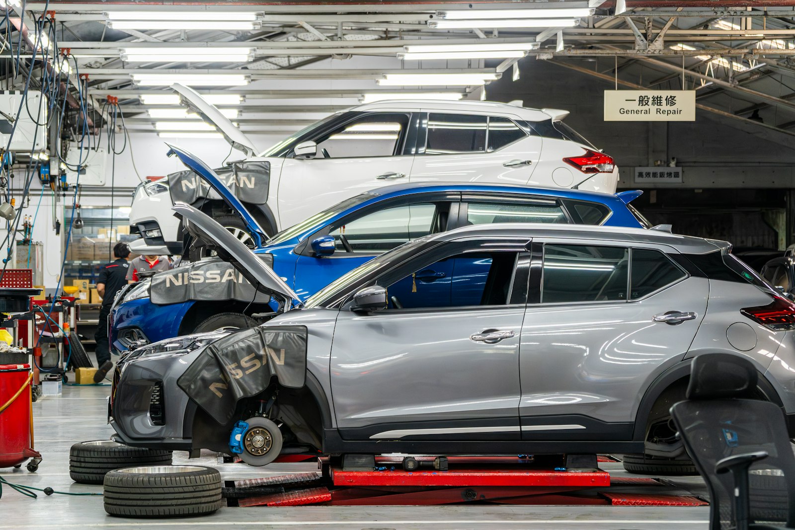 H&M workshop with vehicles in for repair